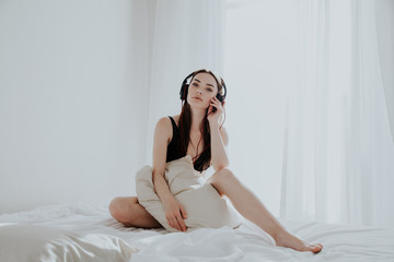 beautiful woman in underwear in the bedroom on the bed in the morning