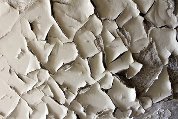 Cracked broken destroyed torn apart old house wall insulation texture at abandoned industrial complex background wallpaper