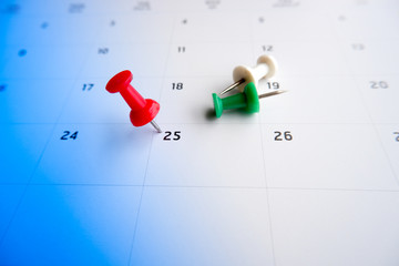 Thumbtack a date on calendar concept for important date, meeting reminder, planning for business,...