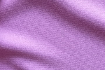 Fototapeta na wymiar Top view of Beautiful cloth fabric texture background of pastel purple dress. Soft surface detail with wave and motion. Decorative, fashion concept with copy space for text.