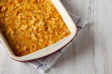 Homemade Funeral Potatoes Casserole in a dish, low angle view. Close-up. Space for text.