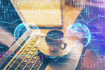 Financial graph colorful drawing and table with computer on background. Double exposure. Concept of international markets.