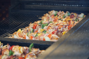 Barbecue with delicious grilled meat on grill on christmas market