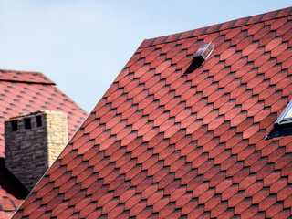 Decorative metal tile on a roof