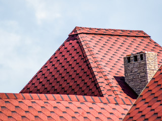 Decorative metal tile on a roof