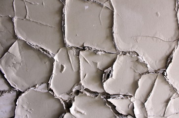 Strange texture of torn apart cracked broken destroyed old house wall insulation at abandoned...