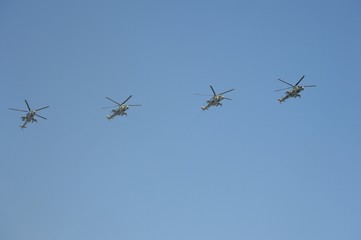 Rehearsal of the Victory Day celebration (WWII). The airshow on the Red Square.  group of Mil Mi-24 (Hind) attack and landing helicopter