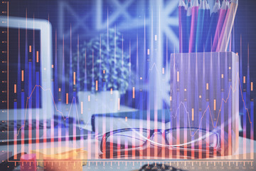 Financial chart hologram with glasses on the table background. Concept of business. Double exposure.