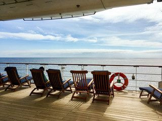 Wooden Deck chairs on Cunard luxury and legendary ocean liner Queen Mary 2 cruise ship QM2 on...