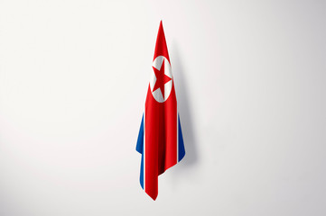 Obraz premium North Korea Flag Hanging Isolated with Copy Space - 3D Illustration