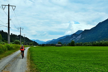 Fototapeta premium Austria- cyclists on the cycle path along the railway
