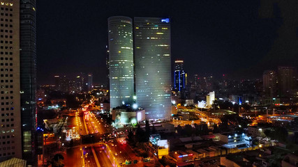 Aerial view on Tel-Aviv. Urban night city never stops. Luxury building and tall towers