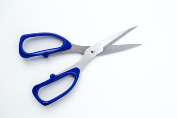 Blue scissors isolated on a white background.