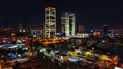 Aerial view on Tel-Aviv. Urban night city never stops. Luxury building and tall towers