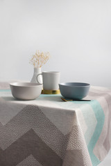  cup on a light table, table setting, breakfast