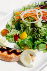 organic mixed vegetable salad with salmon fillet and balsamic vinaigrette