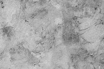 Texture of a concrete wall with cracks and scratches which can be used as a background