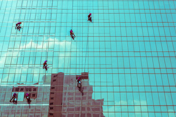 window washers on a highrise office building, sweet tone filter effect