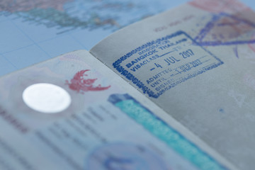 Inside page of a well traveled european passport with all kinds of stamps 