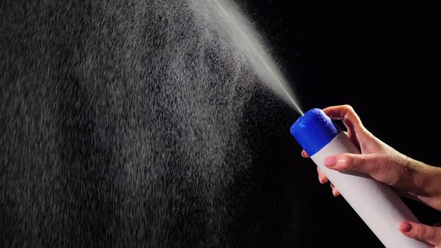 Splashes of liquid sprayed up from the spray can