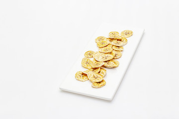 Dried slices of banana isolated on white background