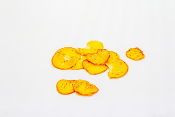 Dried slices of persimmon isolated on white background