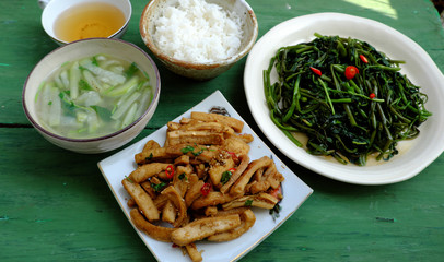 Top view simple vegan meal for daily family menu, fried tofu cook with sauce, water spinach,...
