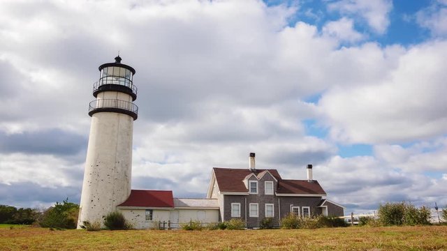 Clouds passing by a lighthouse in Highland, Cape Cod, Massachusetts, USA