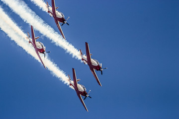four airplane demonstrate in an event