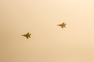two f15 combat airplane in a fog