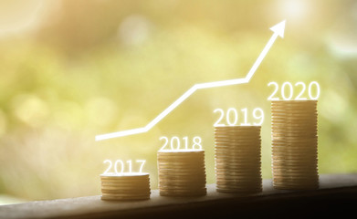 Growth in 2020 year concept. Business graph with arrow up. Growing money coins stack.