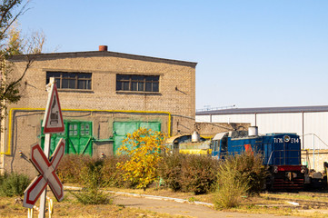 Old diesel locomotive in a depot. Production and transportation. Railway and trains.