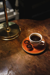 Black americano espresso coffee with chocolate sweets