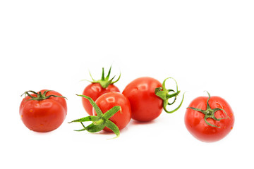ripe fresh organic tomatoes in drops of dew isolated on white background