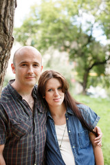 Beautiful young family, man and pregnant woma