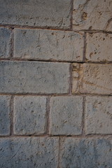 Vintage grunge stone blocks wall texture.