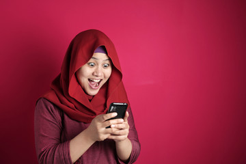 Young Muslim Woman Get Good News on Her Phone