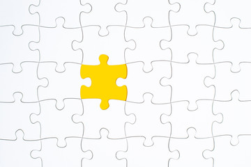 Fototapeta premium Puzzle Pieces - white with yellow missing space