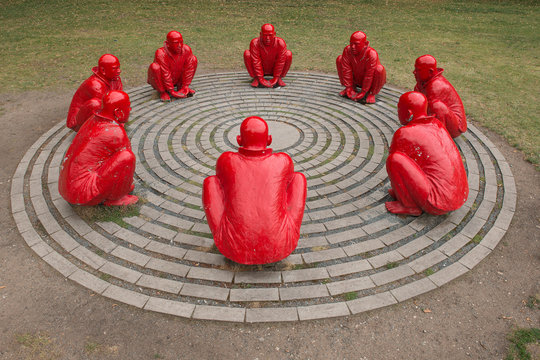 Bamberg, Germany - July 15, 2019: Art work with 8 red men called Meeting from Wang Shugang on the Schonleinplatz in Bamberg in Germay