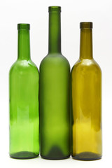 three empty bottles of wine on white background