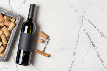 Wine bottle with mock-up label and corkscrew with corks