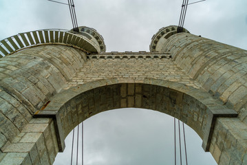View on arch of bridge against cloudy sky. Bridge in route beetween France and Geneva, Switzerland.