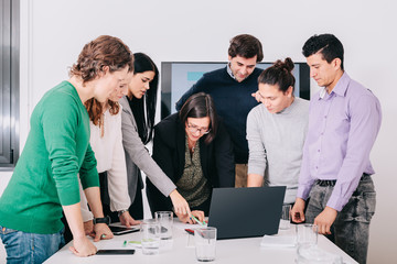 Fototapeta premium Group of office workers at a meeting around the boss
