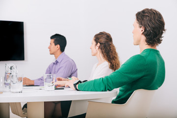 Obraz premium Group of office workers at a meeting around the boss