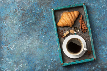 Appetizing crispy croissant and coffee for tasty breakfast