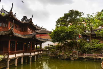 Fototapeta premium Beautiful, traditional buildings by the water in Yu Garden, Shanghai, China