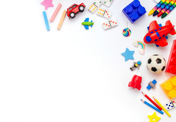 Frame of kids toys on white background with copyspace