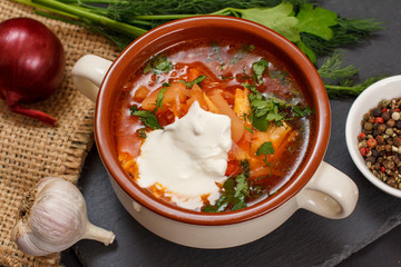 Ukrainian traditional borsch with sour cream and spices.