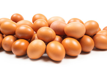 Group of brown eggs isolated on white.