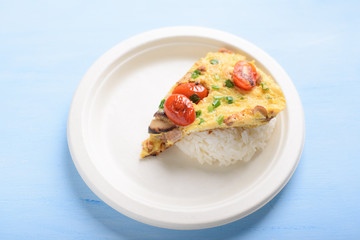 Minced pork omelette and rice on a paper plate to save the world